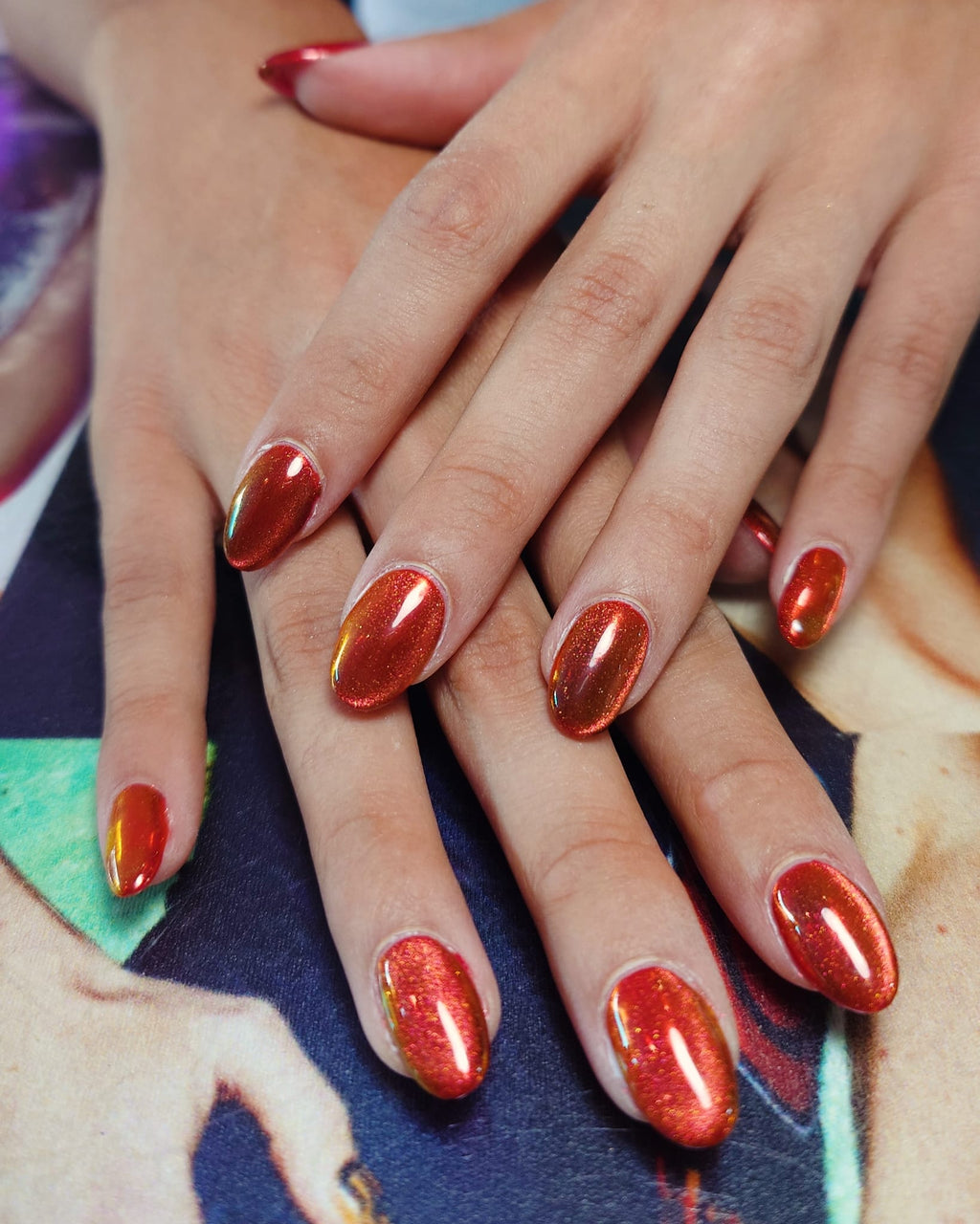 Red magnetic cat-eye nail design created with ICEGEL